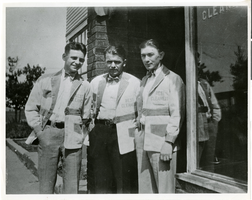 Black-and-white photograph of Wilbur Clark and two unidentified men in front of Best Cleaners, Keyesport, Illinois, 1924