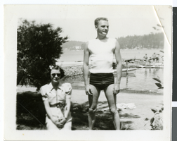 Black-and-white photograph of Wilbur Clark and an unidentified woman near a river, circa 1930s