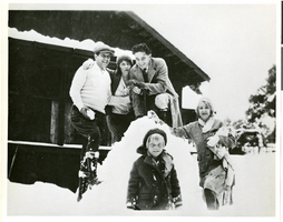 Black-and-white photograph of Wilbur Clark with a group of people posing in the snow, Springfield, Illinois, circa 1923-1931