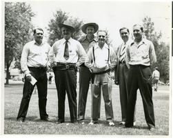 Black-and-white photograph of Wilbur Clark with a group of unidentifed men, circa late 1920s-early 1930s