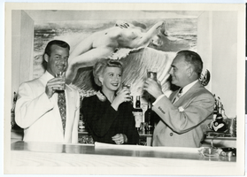 Photograph of Wilbur Clark Clark and guests at a bar, Las Vegas, Nevada, circa late 1940s-early 1950s