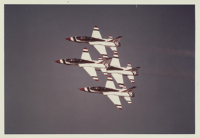 Photograph of Thunderbirds planes performing aerial stunts, 1980