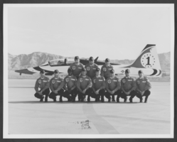 Photograph of Thunderbird pilots posing by a plane, Nellis Air Force Base, Nevada, circa 1970s to 1980s