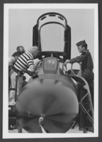 Photograph of 385th Bombardier Group veterans inspecting aircraft at Nellis Air Force Base, Nevada, May 5, 1977