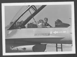 Photograph of Captain Daniel P. Conroy and another pilot in a plane, Nellis Air Force Base, Nevada, April 29, 1983