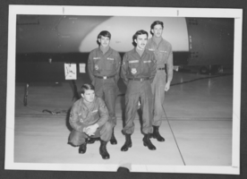 Photographer of the winners of a bomb loading competition at Nellis Air Force Base, Nevada, January 30, 1974