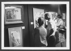 Photograph of people viewing military art exhibit at the Las Vegas Art Museum at Lorenzi Park, Las Vegas, Nevada, July 24, 1979