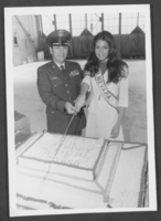 Photograph of Colonel William Strand and Miss Nevada at a celebration for the 30th anniversary of the Tactical Air Command, Nellis Air Force Base, Nevada, March 25, 1976