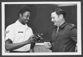 Black-and-white photograph of Sergeant Leroy Kelley, Jr. and Colonel William Strand, Nellis Air Force Base, Nevada, March 22, 1976