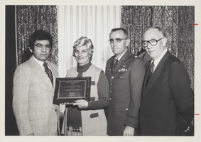 Photograph of a plaque being presented by the Small Business Administration, Nellis Air Force Base, Nevada, October 25, 1976