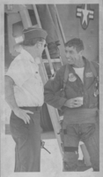 Photograph of military personnel standing next to a plane, Nellis Air Force Base, Nevada, circa 1970s