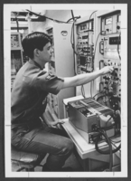 Photograph of an Airman of the Month at work, Nellis Air Force Base, Nevada, May 12, 1975