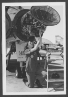 Photograph of Airman First Class Carol Johnson working on an F-4 Phantom, Nellis Air Force Base, Nevada, May 13, 1975