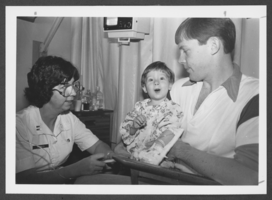 Photograph of a boy being treated at the Nellis Air Force Base hospital, Nevada, December 26, 1982