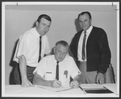 Photograph of men discussing the creation of a national park, North Las Vegas, June 10, 1965