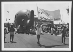 Photograph of people and an elephant float at the North Las Vegas 25th anniversary parade, North Las Vegas, Nevada, April-May, 1971