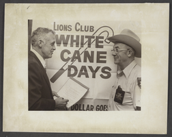 Photograph of North Las Vegas Mayor Ray Daines signing proclamation declaring White Cane Week, North Las Vegas, Nevada, October 21, 1977