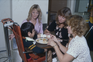 Slide of students with child, University of Nevada, Las Vegas, circa mid 1980s