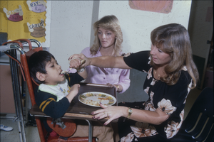 Slide of students with child, University of Nevada, Las Vegas, circa mid 1980s