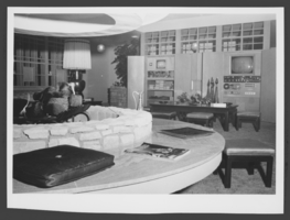 Black-and-white photograph of the view of fireplace and closed circuit television system in Wilbur Clark's living room, Las Vegas, Nevada, circa 1950s