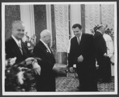 Black-and-white photograph of Russian Premier Nikita Khrushchev at a reception, location unknown, 1959