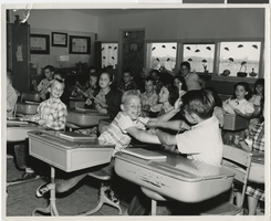 Photograph of children playing at an unidentified school, circa 1950s
