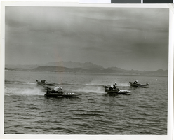Photograph of four boats racing on Lake Mead near Boulder City, circa mid 1950s - early 1960s