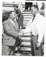 Photograph of unidentified men in front of an airplane, Las Vegas, circa mid 1950s to early 1960s