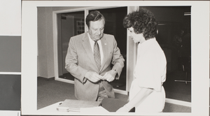 Black-and-white photograph of individuals inside James Dickinson Library, University of Nevada, Las Vegas, October 10, 1981
