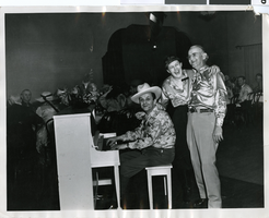Photograph of group in Helldorado garb at Apache Hotel, Las Vegas, circa 1930s to 1950s