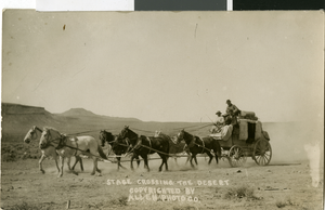 Postcard of a stagecoach in the desert, circa early 1900s