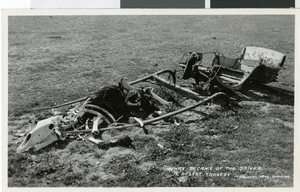 Postcard of a dissheveled wagon and bones, circa early 1900s