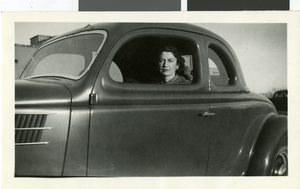Photograph of Maurine Wilson in her car, circa 1940s