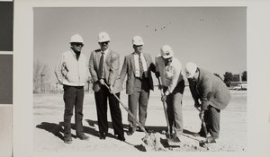Photograph of a group of men breaking ground, University of Nevada, Las Vegas, circa 1991-1992