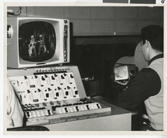 Photograph of Esper Esau in light booth at Stardust Hotel, Las Vegas, 1959