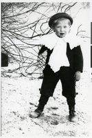 Photograph of a young Anglo child, dressed in black suit, lace collar and dickey, Pahrump Valley, Nevada, circa 1880s-1910s