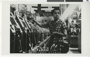 Photograph of Nevada Club interior with old style slot machines, Las Vegas, circa 1940