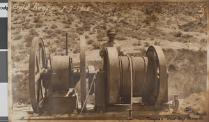 Photograph of a man standing by hoisting equipment at the Gold Reef Mining Company, Tonopah, Nevada, July 7, 1918