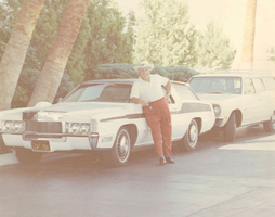 Photograph of Jay Sarno standing by a car, 1970s