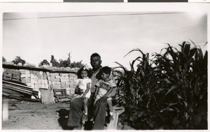 Photograph of Francisco Rivero holding Margaret Rivero and Frankie Varel, 1930s