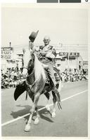 Photograph of Vail Pittman riding a horse in the Helldorado Parade, Las Vegas (Nev.), mid-1940s
