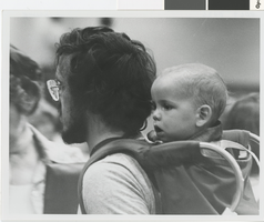 Photograph of an unidentified father and his son participating in the Nevada Women's Conference in Las Vegas (Nev.), June 18, 1977
