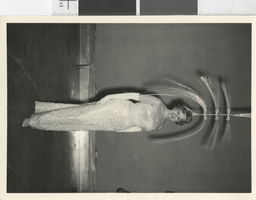 Photograph of a showgirl posing with a headdress, Las Vegas (Nev.), 1957-1960s