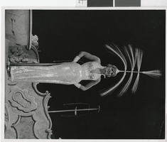 Photograph of a showgirl posing with a headdress onstage, Las Vegas (Nev.), 1957-1960s