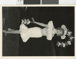 Photograph of topless showgirl posing onstage, Las Vegas (Nev.), 1957-1960s
