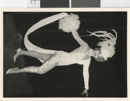 Photograph of costumed showgirl posing onstage, Las Vegas (Nev.), 1957-1960s