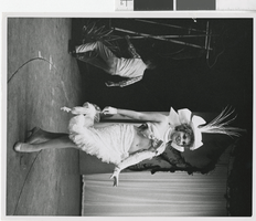 Photograph of topless showgirl with headdress posing onstage, Las Vegas (Nev.), 1957-1960s