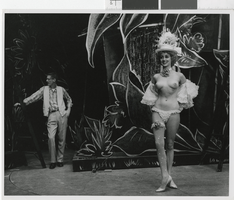 Photograph of topless showgirl in front of stage decorations, Las Vegas (Nev.), 1957-1960s