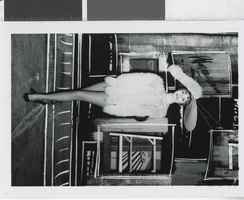 Photograph of showgirl in costume posing onstage, Las Vegas (Nev.), 1957-1960s
