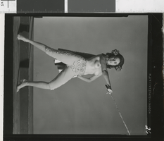 Photograph of topless showgirl in costume backstage, Las Vegas (Nev.), 1957-1960s